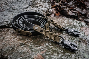 Trailblazer BioThane® cross-body dog leash on wet rocky surface, featuring adjustable hands-free design and braided ends.