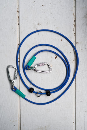 Blue hands-free BioThane® rope leash with carabiners on a white surface, ideal for active dog owners.