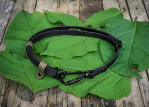 Hands-Free BioThane® adapter with carabiner on green leaves, adjustable belt and shoulder leash adapter for pets.