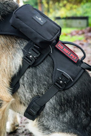 Outlander adjustable dog harness close-up featuring "DO NOT PET" patch and heavy-duty design for comfort and durability.