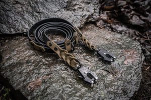 Trailblazer BioThane® adjustable hands-free dog leash with braided ends, displayed on a rock, perfect for adventure-loving dogs.