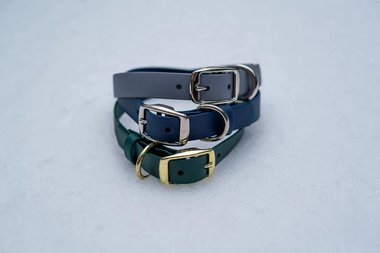 Voyager BioThane® 1" adjustable dog collars in gray, navy, and green with durable buckles, supporting True North GSD Rescue.