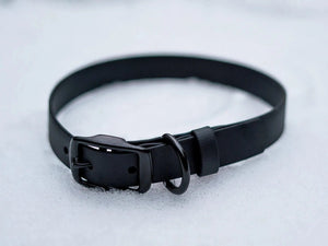 Voyager BioThane 1" adjustable dog collar in black with heavy-duty buckle, durable and easy to clean. Profits support dog rescue.